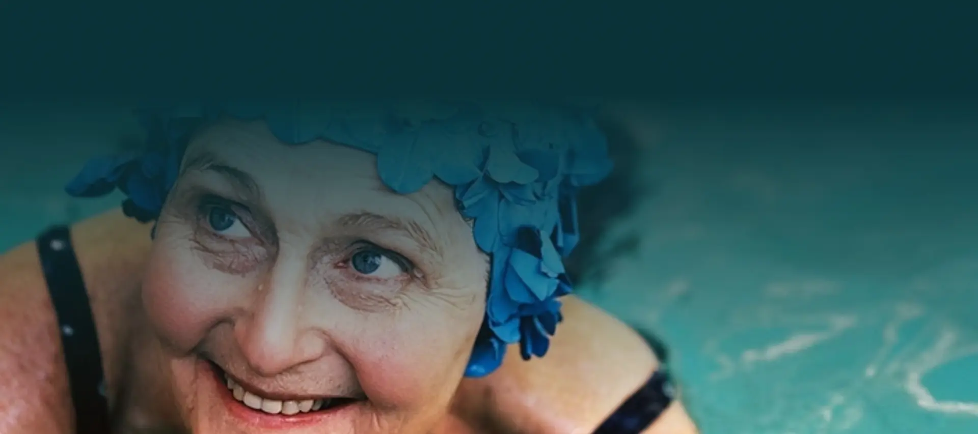 Cheerful caregiver assisting a senior client at home, showing compassionate care