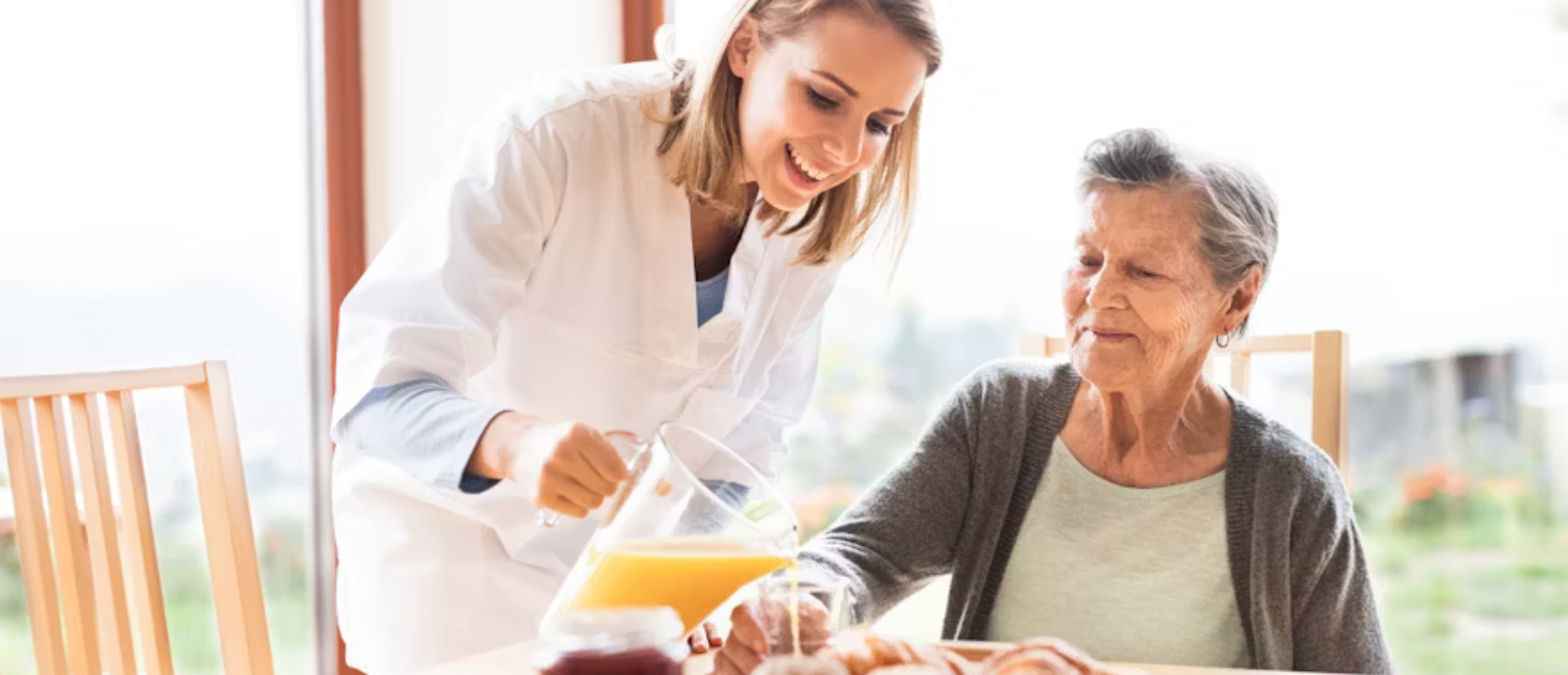 Happy senior client smiling with a caregiver in their Port Orchard home