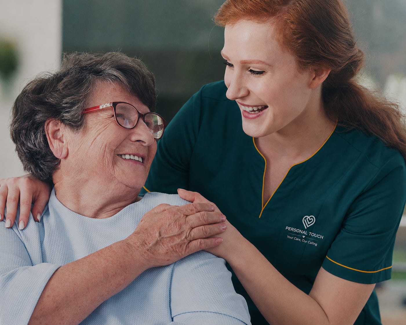 Caregiver smiling with senior client